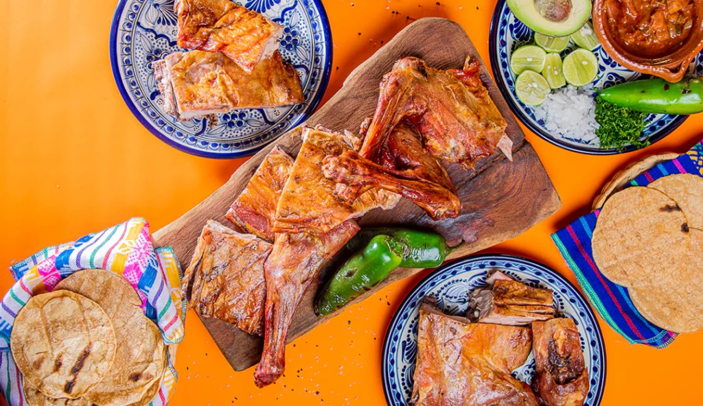 Tabla de cabrito al pastor con aguacate, limón y jalapeño